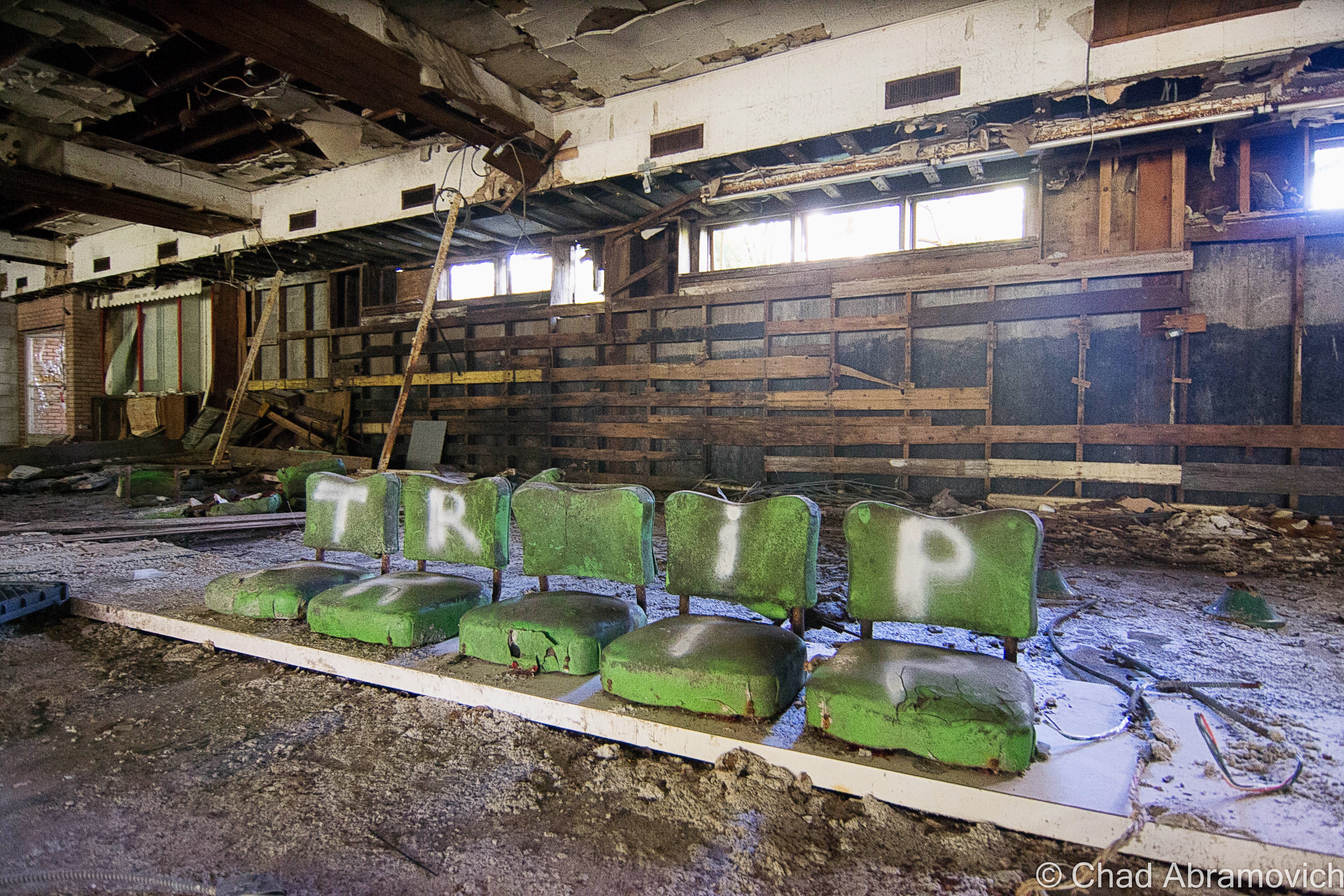 These 4 rotting bar stools are a photographic icon of this property. At one point, there were more of them, and they were all standing in a row lining the bar that they once accompanied. Today, only these 4 remain, barely.