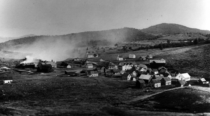 A mine crawling with bodies required a village to be built, and one of more than 100 buildings was constructed over hillsides dumped with a gamut of mine related waste byproducts and very little vegetation. 