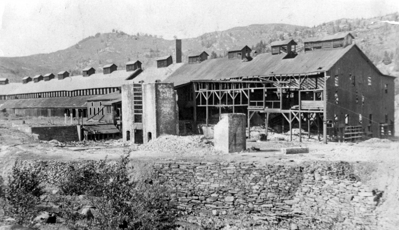 This is one of the smelting sheds at the Ely mine, taken around 1960, decades after it's abandonment, the wobbly structure still stands. | UVM Landscape Change Program.